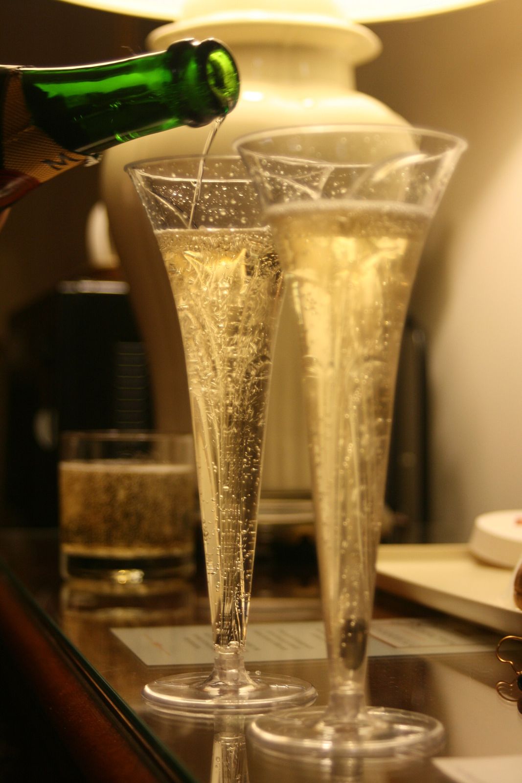 Champagne being poured into flutes