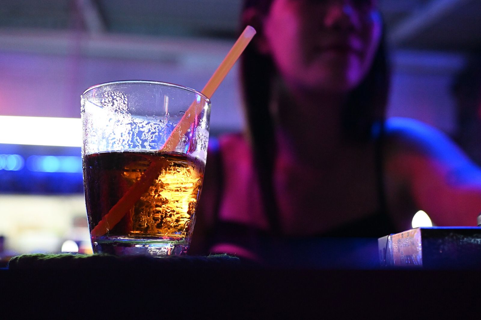 Cocktail in a neon-lit nightlife bar